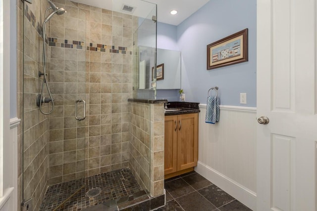 810 Terry Ln, Key West, FL 33040 - bathroom with vanity, a stall shower, wainscoting, and tile patterned flooring