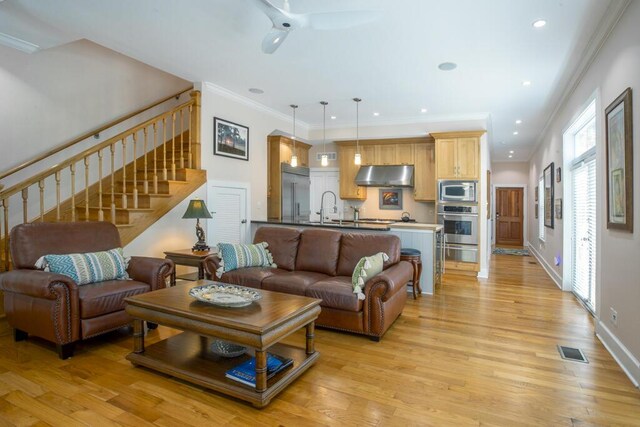 810 Terry Ln, Key West, FL 33040 - living area with stairway, light wood-style flooring, ceiling fan, crown molding, and recessed lighting