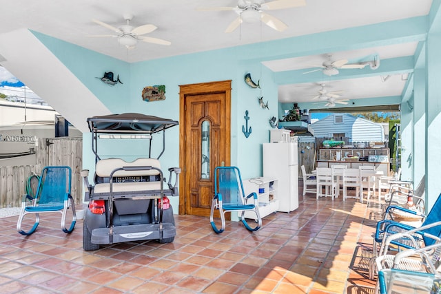 view of patio featuring an outdoor bar and ceiling fan