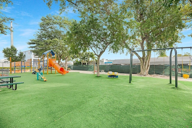 view of play area featuring a lawn