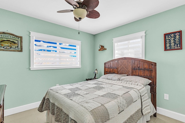 tiled bedroom with ceiling fan