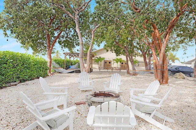 view of patio / terrace with an outdoor fire pit