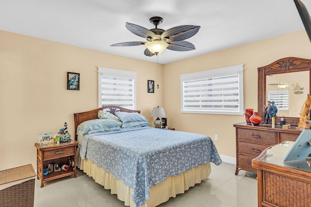 tiled bedroom with ceiling fan