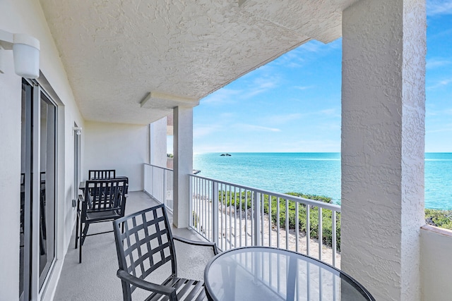 balcony featuring a water view