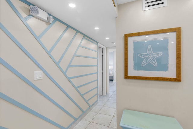 hall featuring light tile patterned flooring