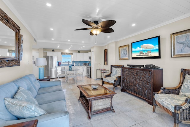 living room featuring light tile patterned floors, ornamental molding, and ceiling fan