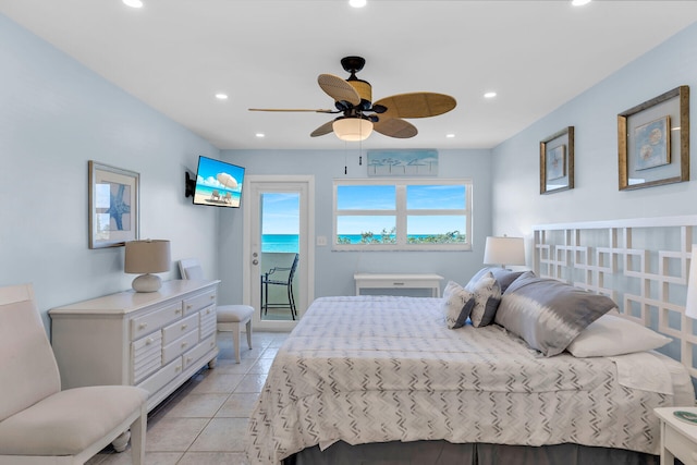 bedroom featuring multiple windows, light tile patterned floors, access to outside, and ceiling fan