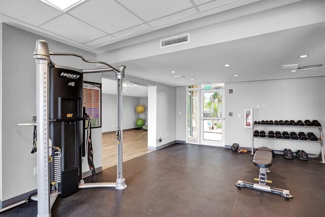 exercise room featuring a paneled ceiling