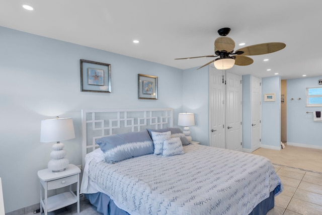 bedroom with light tile patterned floors and ceiling fan