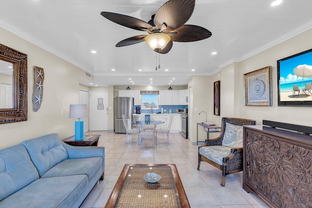 tiled living room with crown molding and ceiling fan