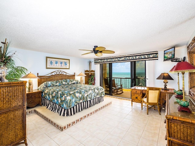 101 E Ocean Dr Unit C304, Key Colony, FL 33051 - tiled bedroom with access to outside and a textured ceiling