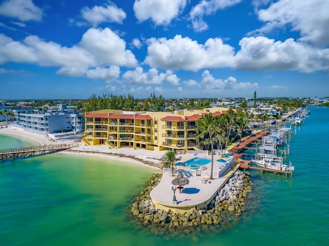 bird's eye view featuring a view of the beach and a water view