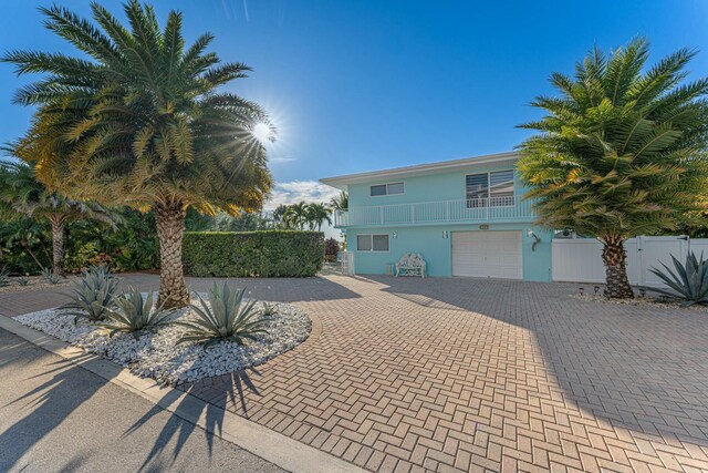 view of front of house with a balcony and a garage