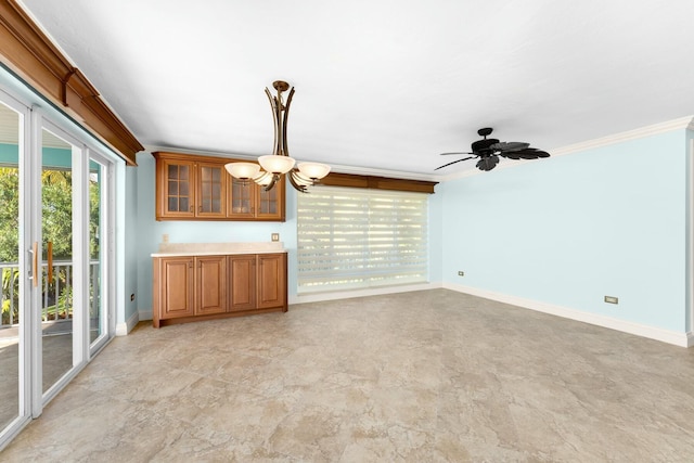 unfurnished living room with crown molding and ceiling fan with notable chandelier