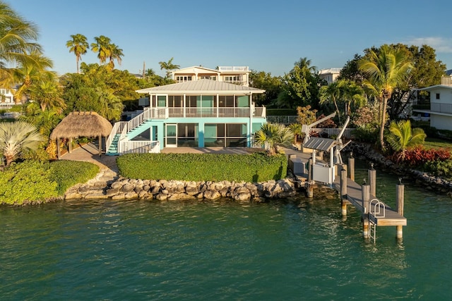 rear view of house with a water view