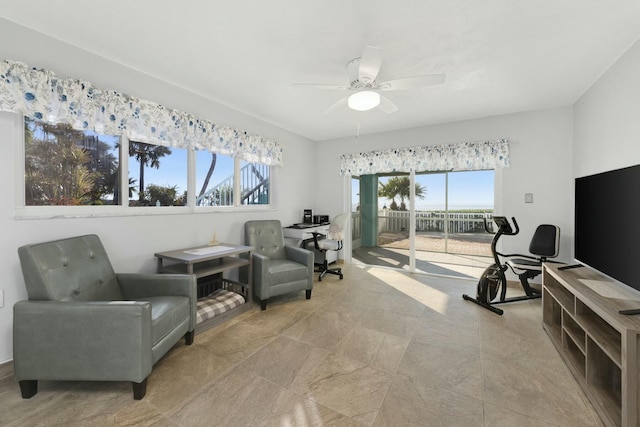 living area with ceiling fan