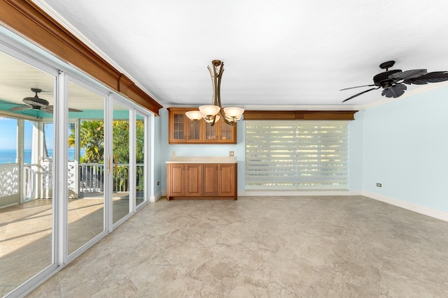 unfurnished living room with a water view, crown molding, and ceiling fan with notable chandelier