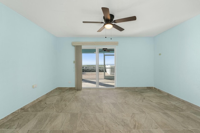 spare room with ceiling fan