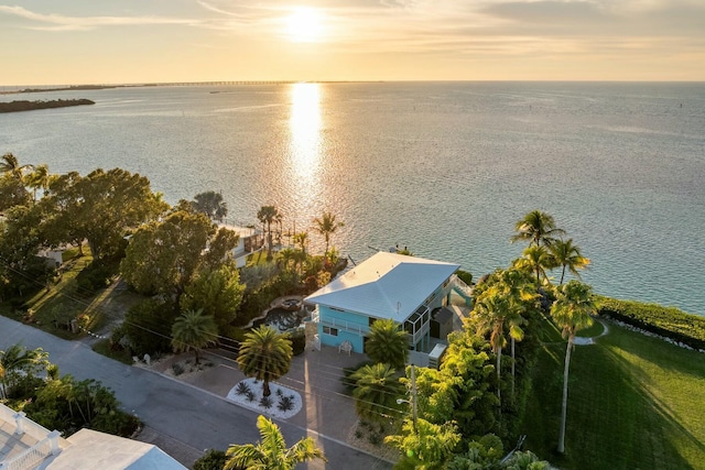 aerial view at dusk with a water view