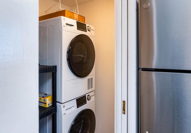 washroom with stacked washer and dryer