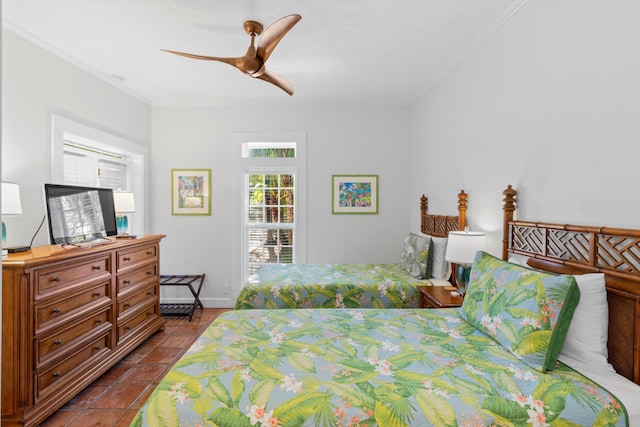 tiled bedroom with ceiling fan and ornamental molding