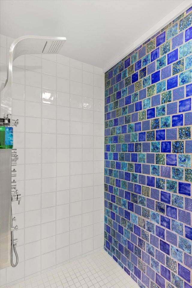 bathroom with a tile shower