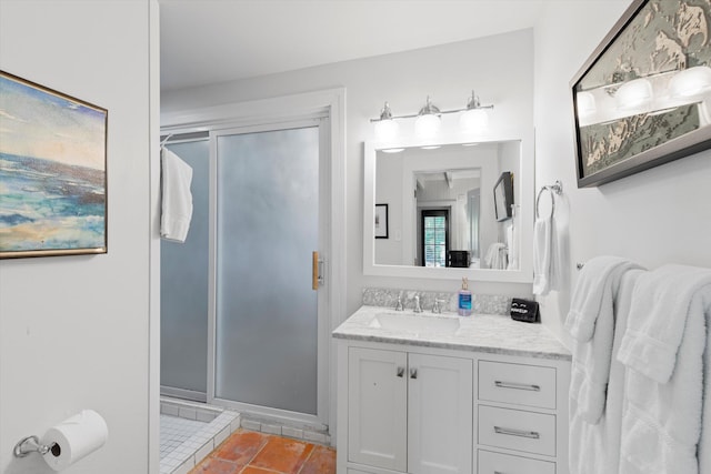 bathroom featuring vanity, an enclosed shower, and tile patterned floors