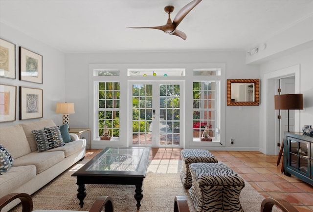 tiled living room with ceiling fan and french doors