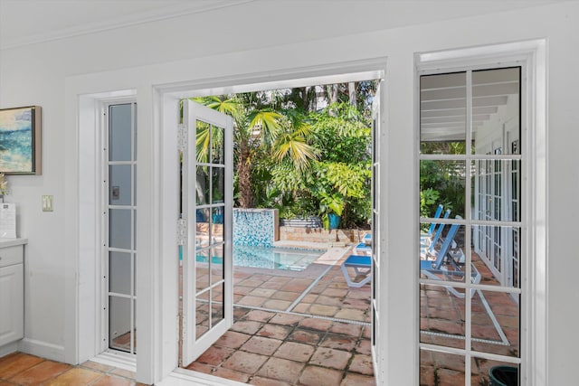 doorway featuring ornamental molding