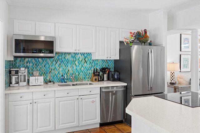 kitchen featuring white cabinetry, appliances with stainless steel finishes, and sink