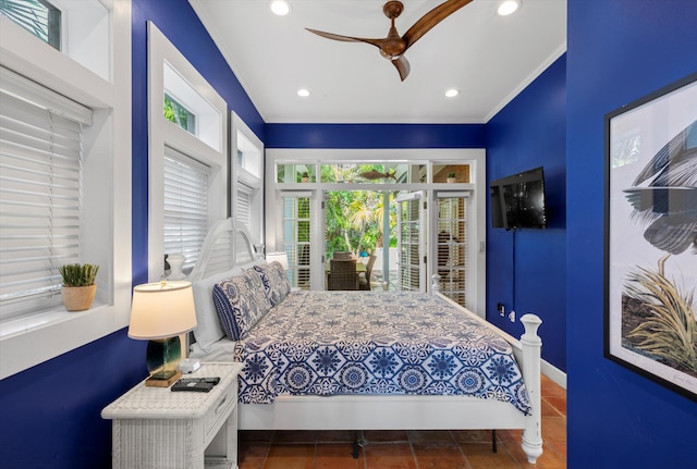 tiled bedroom with ceiling fan, ornamental molding, and access to exterior