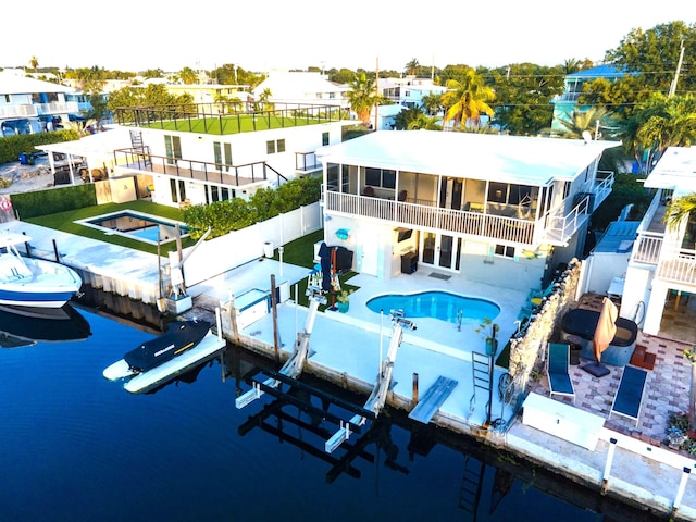 birds eye view of property with a water view