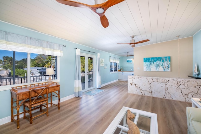 living room with wooden ceiling, light hardwood / wood-style floors, french doors, and ceiling fan