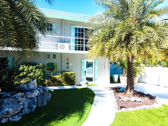 view of front of house with a balcony