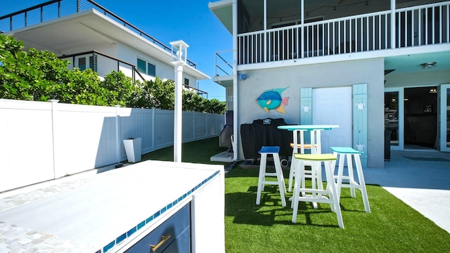 view of patio featuring a balcony