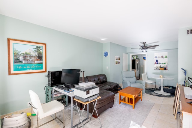 tiled living room with ceiling fan