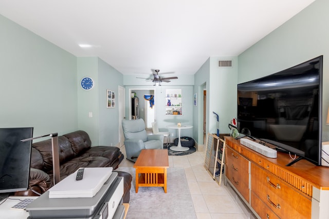 tiled living room with ceiling fan