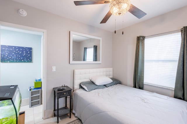 bedroom featuring light tile patterned flooring and ceiling fan