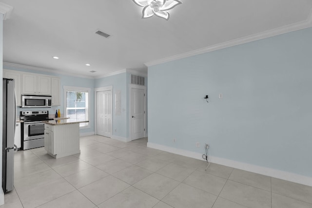 kitchen featuring stainless steel appliances, ornamental molding, light stone countertops, and white cabinets