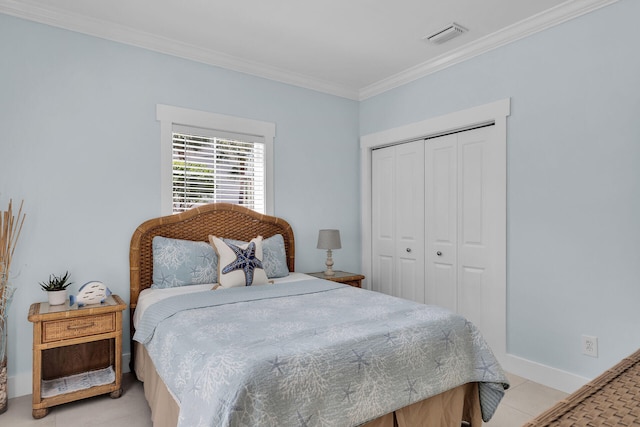 bedroom featuring ornamental molding and a closet