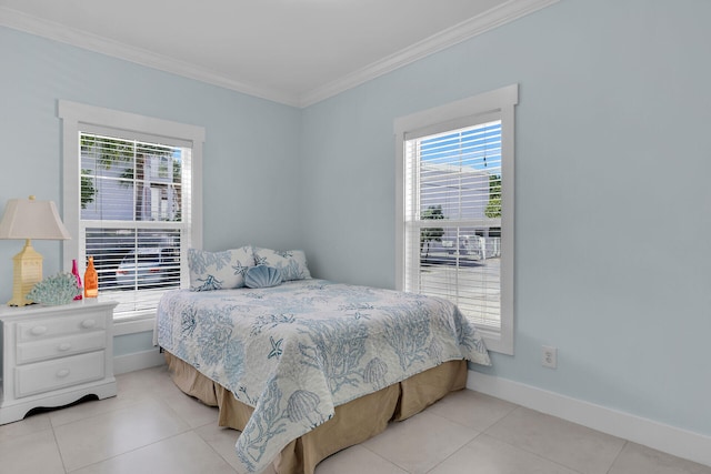 bedroom featuring light tile patterned floors and ornamental molding