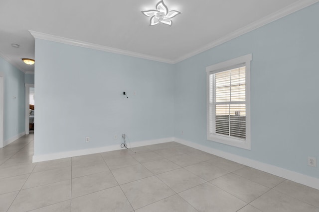 unfurnished room with ornamental molding and light tile patterned flooring