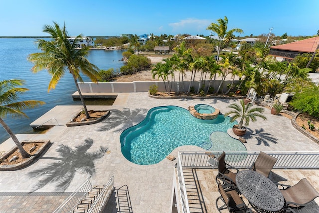3742 Seagrape St, Big Pine, FL 33043 - view of pool featuring a patio, a water view, and a pool with connected hot tub