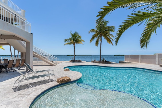 3742 Seagrape St, Big Pine, FL 33043 - outdoor pool with stairs, a patio area, and a water view