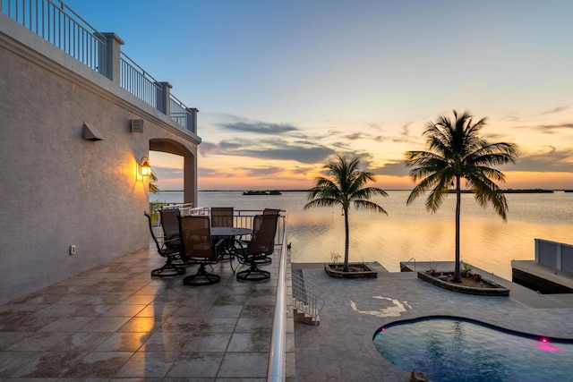 3742 Seagrape St, Big Pine, FL 33043 - patio terrace at dusk featuring a balcony, a patio, and a water view
