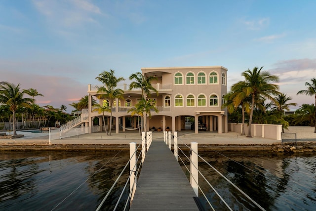 3742 Seagrape St, Big Pine, FL 33043 - dock with a balcony, stairway, a water view, and a patio area