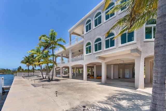3742 Seagrape St, Big Pine, FL 33043 - back of property with a balcony, a ceiling fan, and a carport