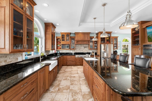 3742 Seagrape St, Big Pine, FL 33043 - kitchen featuring appliances with stainless steel finishes, a sink, decorative backsplash, a tray ceiling, and recessed lighting