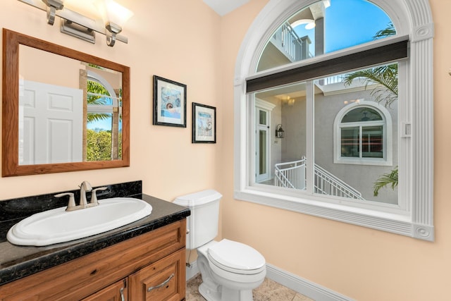 3742 Seagrape St, Big Pine, FL 33043 - half bathroom with toilet, vanity, baseboards, and tile patterned flooring