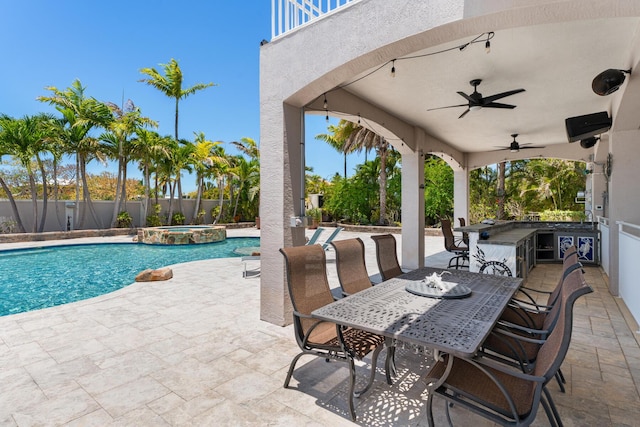 3742 Seagrape St, Big Pine, FL 33043 - view of swimming pool featuring a patio area, a fenced backyard, a ceiling fan, a bar, and a pool with connected hot tub